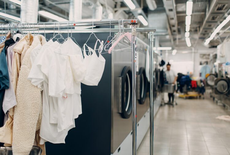 Dry cleaning clothes. Clean cloth chemical process. Laundry industrial dry-cleaning