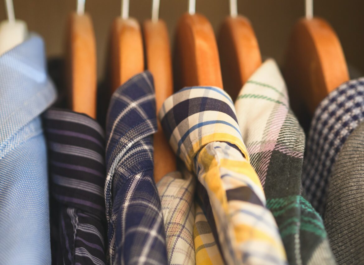 Man's closet hangers shirts closeup