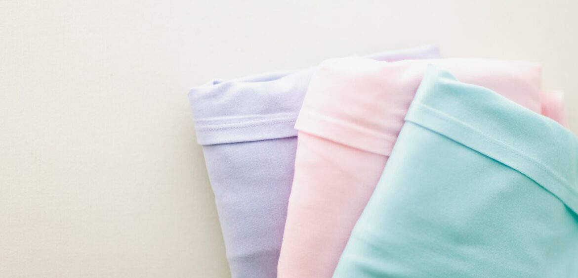 Organized and folded pastel shirts.