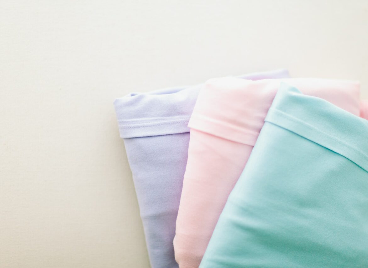 Organized and folded pastel shirts.