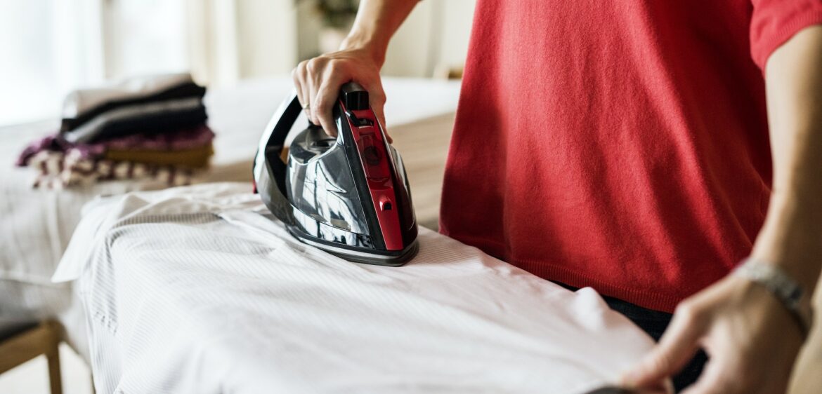 Woman ironing shirt
